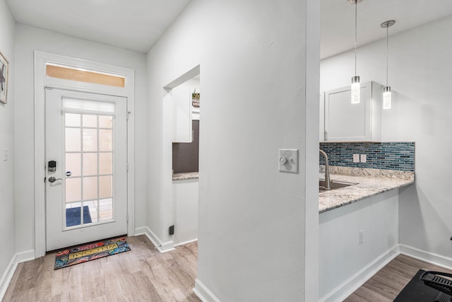 interior space featuring sink and light hardwood / wood-style floors