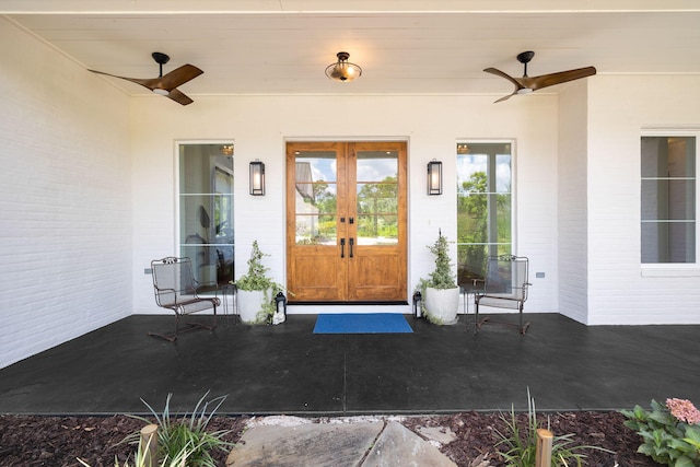 entrance to property with french doors and ceiling fan