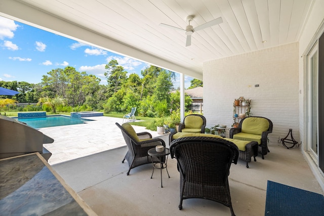 view of patio / terrace with ceiling fan and an outdoor living space