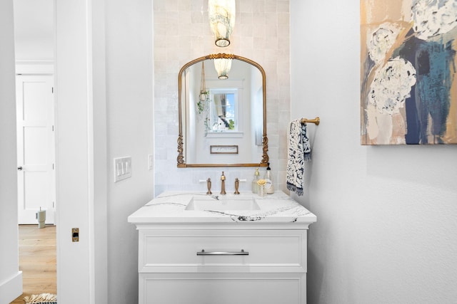 bathroom with vanity and hardwood / wood-style flooring