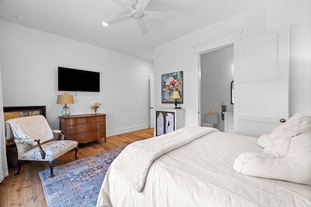 bedroom featuring ceiling fan and light hardwood / wood-style floors