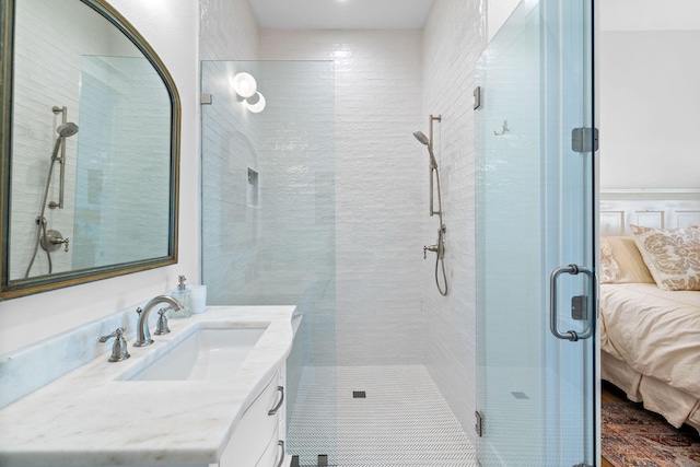 bathroom with an enclosed shower and vanity