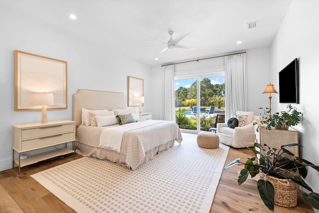 bedroom featuring ceiling fan, access to exterior, and light hardwood / wood-style floors