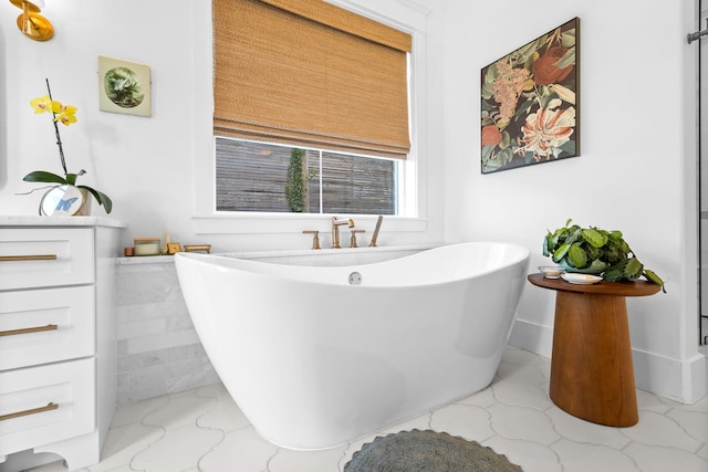 bathroom featuring tile patterned floors and a bathing tub