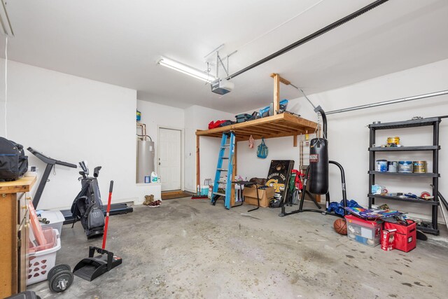 garage with water heater and a garage door opener