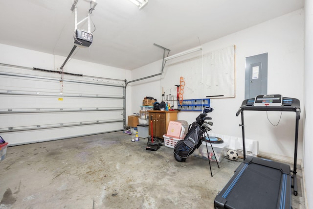 garage featuring a garage door opener and electric panel