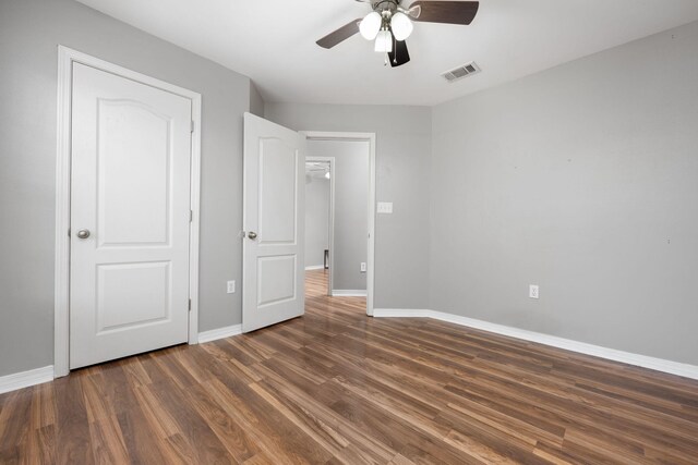 spare room featuring hardwood / wood-style floors and ceiling fan