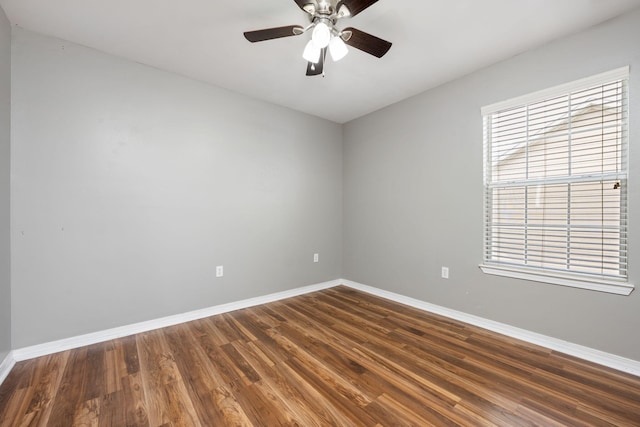 unfurnished room with ceiling fan, plenty of natural light, and wood-type flooring