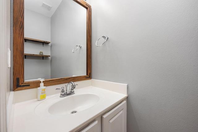 bathroom featuring visible vents and vanity