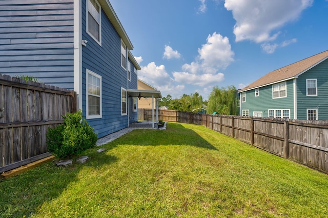 view of yard featuring a fenced backyard