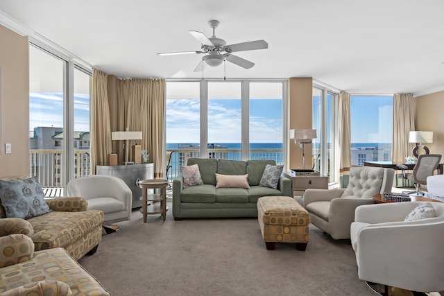 15100 Emerald Coast Pkwy Ph 2, Destin, FL 32541 - carpeted living area with expansive windows, ceiling fan, and a water view