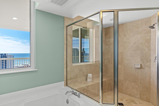 15100 Emerald Coast Pkwy Ph 2, Destin, FL 32541 - full bath with a water view, a garden tub, visible vents, and a shower stall