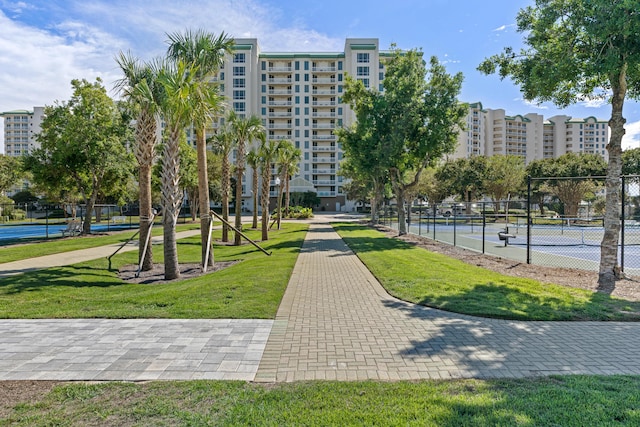 15100 Emerald Coast Pkwy Ph 2, Destin, FL 32541 - view of home's community featuring a yard, a city view, a tennis court, and fence