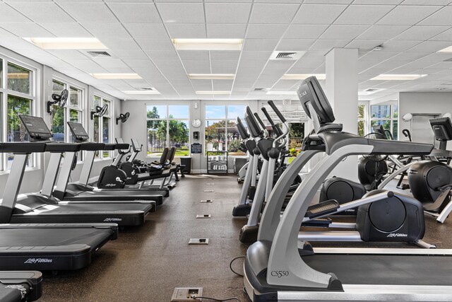 15100 Emerald Coast Pkwy Ph 2, Destin, FL 32541 - exercise room with a healthy amount of sunlight, visible vents, and a drop ceiling