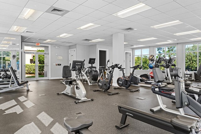 15100 Emerald Coast Pkwy Ph 2, Destin, FL 32541 - gym with visible vents, a paneled ceiling, and a wealth of natural light