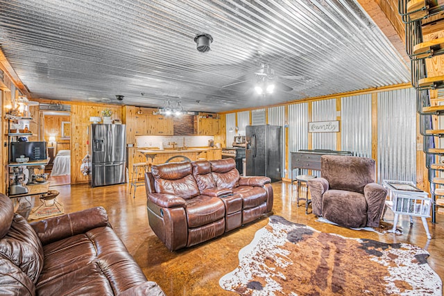 living room with ceiling fan and sink