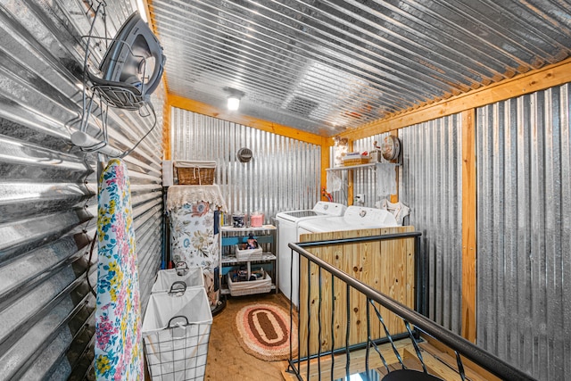 storage room featuring washing machine and clothes dryer