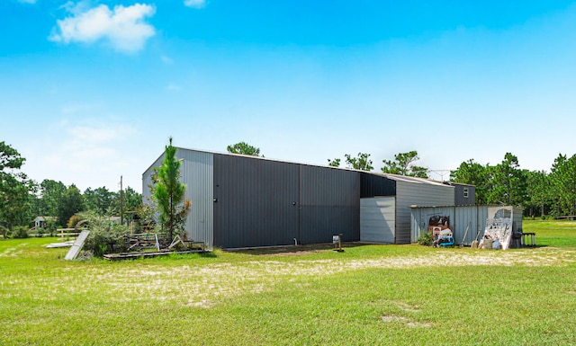 view of outdoor structure with a yard