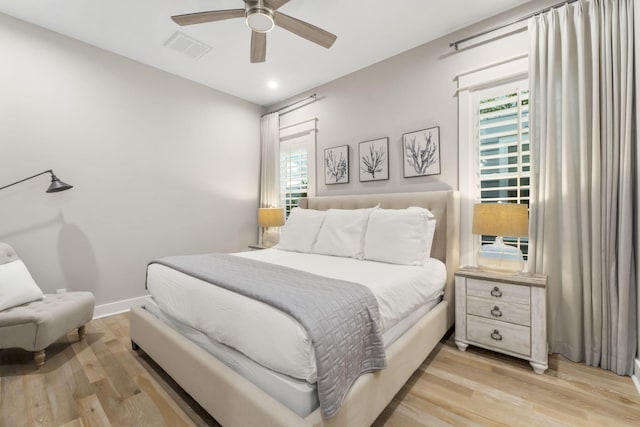 bedroom featuring ceiling fan and light hardwood / wood-style flooring