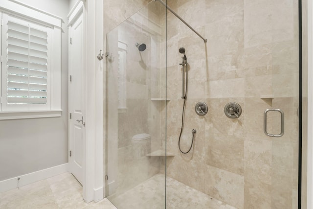 bathroom with a shower with shower door