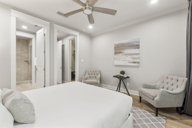 bedroom featuring ensuite bathroom, ceiling fan, and light hardwood / wood-style floors