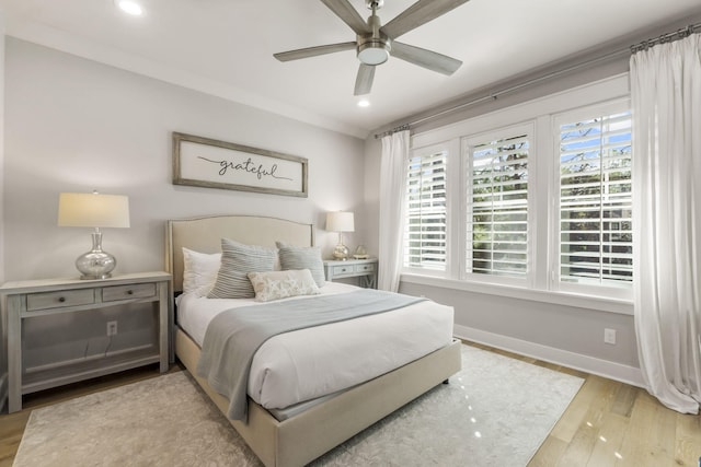 bedroom featuring ceiling fan and light hardwood / wood-style floors