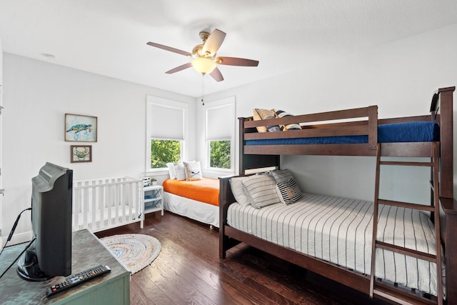 bedroom featuring dark hardwood / wood-style floors and ceiling fan