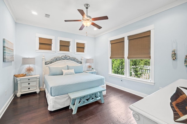 bedroom featuring dark wood-type flooring, ceiling fan, and ornamental molding