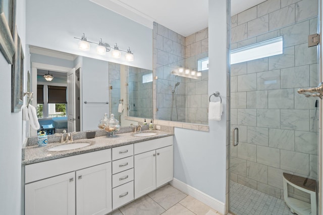 bathroom featuring an enclosed shower, vanity, and ceiling fan