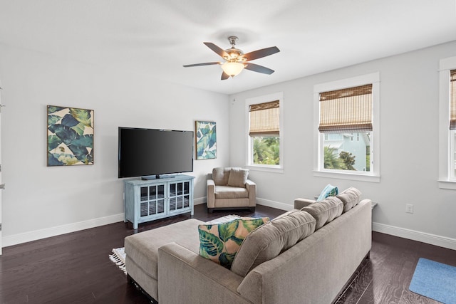 living room featuring dark hardwood / wood-style flooring and ceiling fan