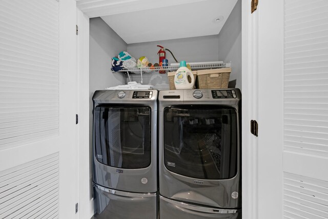 washroom featuring washing machine and dryer