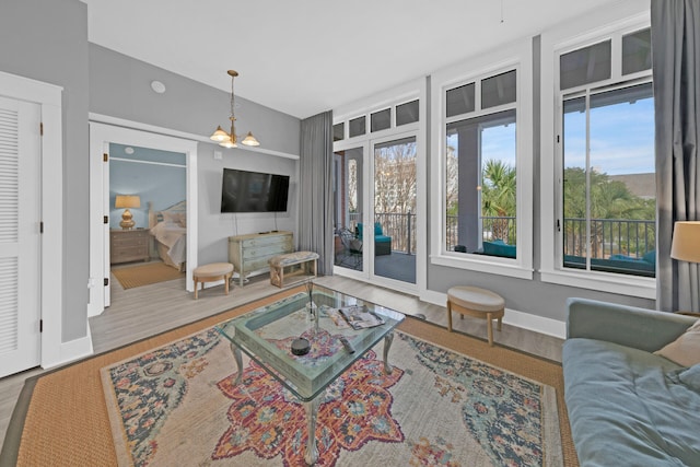 living room with a chandelier and hardwood / wood-style floors