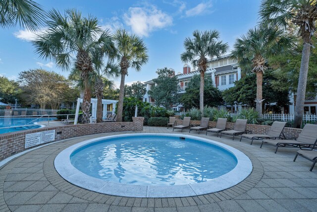 view of swimming pool with a patio area