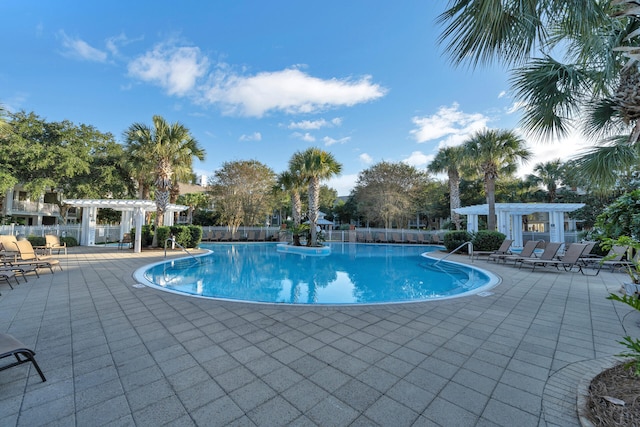 view of pool with a pergola and a patio area