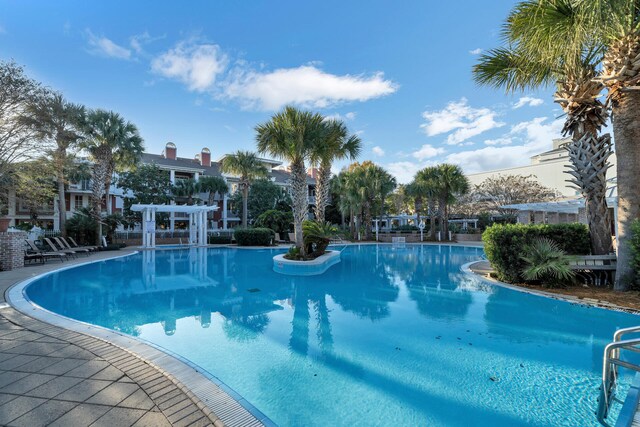 view of swimming pool with a pergola and a patio