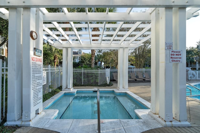 view of swimming pool featuring a pergola