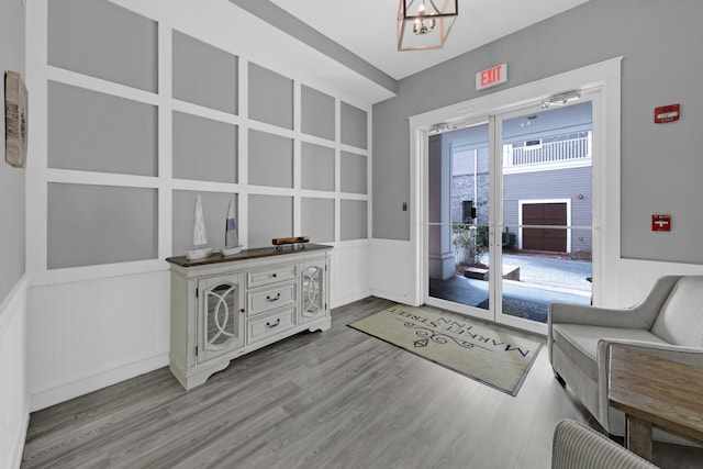 living area featuring a notable chandelier and wood-type flooring