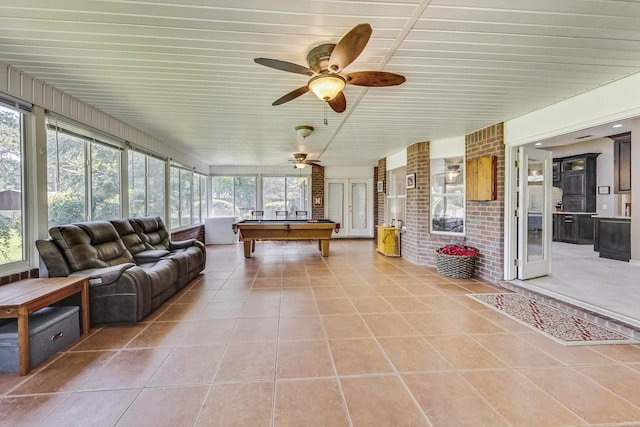 sunroom / solarium featuring billiards and ceiling fan