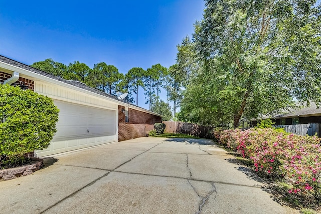 view of property exterior with a garage