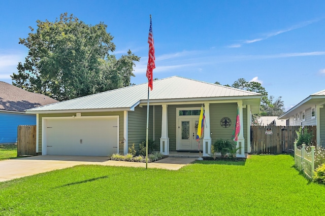 view of front of home with a garage, a porch, and a front yard