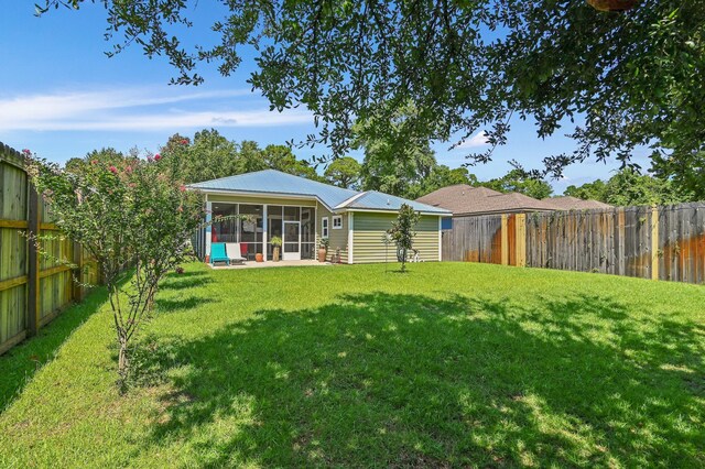 view of yard featuring a sunroom