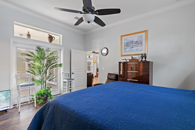 bedroom featuring ceiling fan, wood-type flooring, and ornamental molding