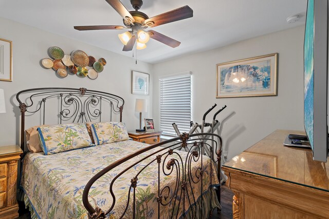 bedroom featuring ceiling fan and wood-type flooring