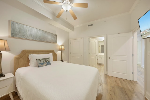 bedroom with light hardwood / wood-style flooring, ornamental molding, ceiling fan, and ensuite bathroom