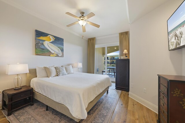 bedroom featuring ceiling fan, hardwood / wood-style flooring, and crown molding