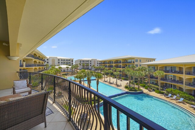 balcony featuring a community pool