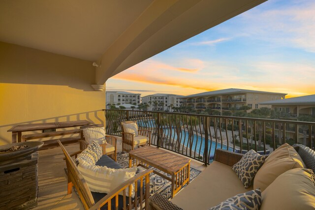 balcony at dusk with outdoor lounge area