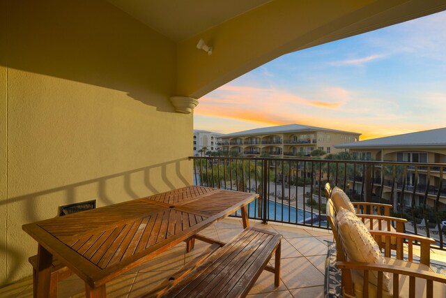 view of balcony at dusk