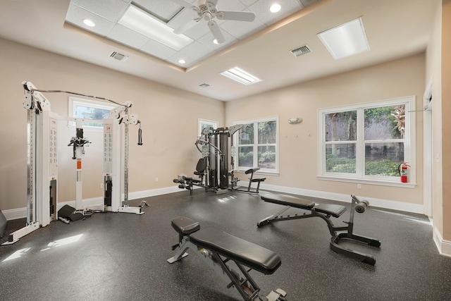 workout area featuring ceiling fan and a healthy amount of sunlight