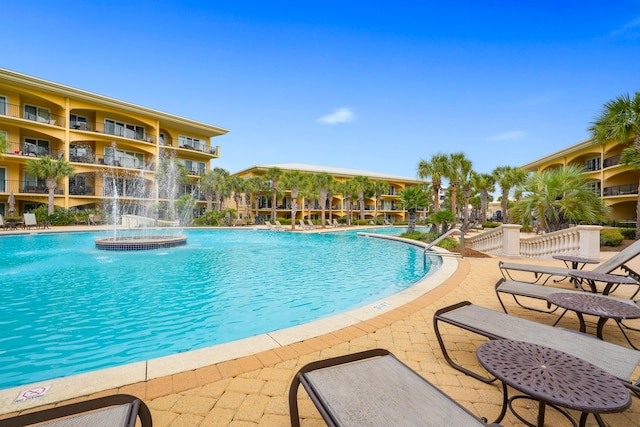 view of pool with pool water feature